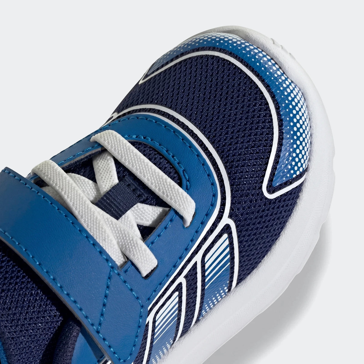 Close-up of Adidas Tensaur Run 4.0 Infants shoes in blue and white mesh with white laces, showing the front-top view.