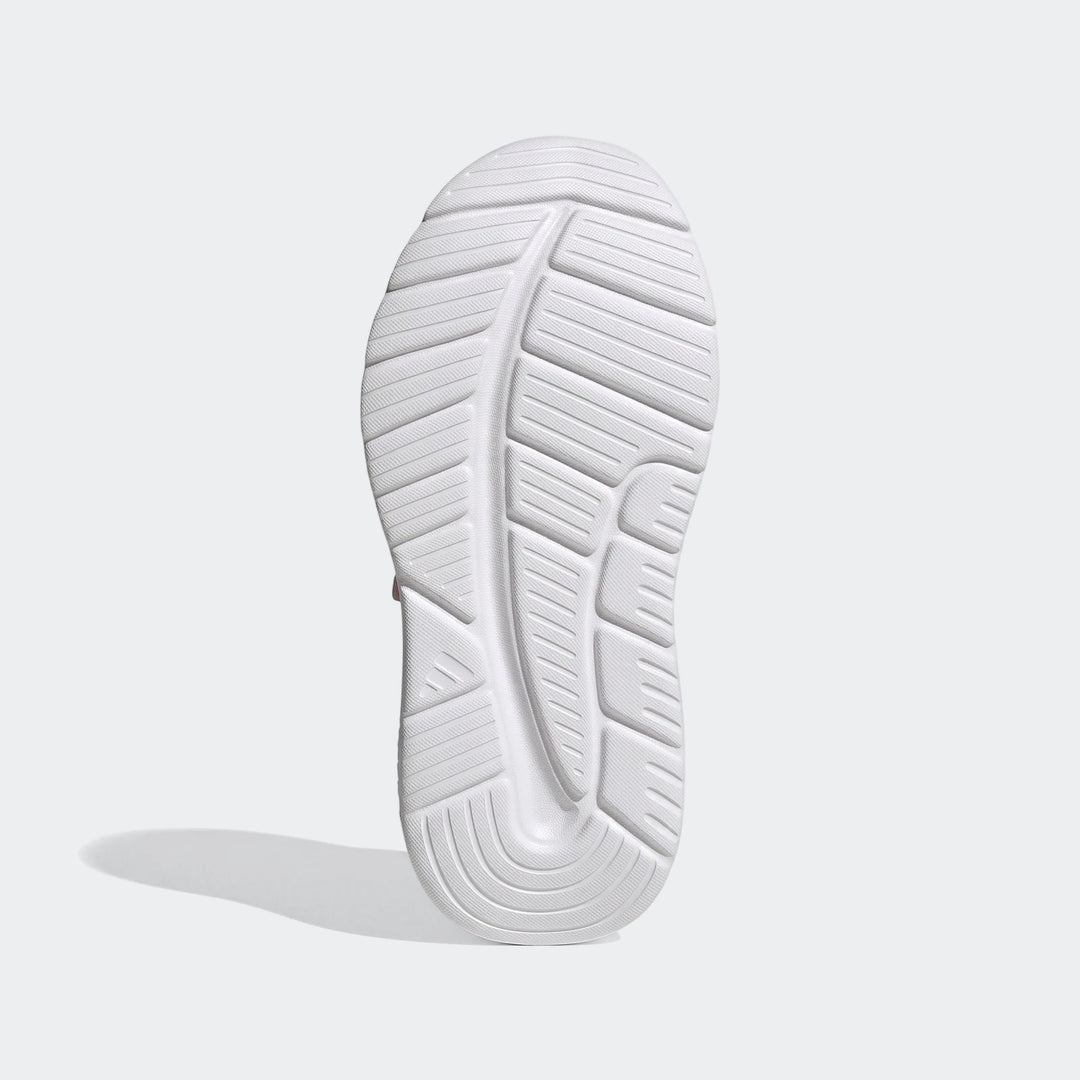 Bottom view of a white Adidas Tensaur Run 4.0 children's shoe sole, featuring a textured grip pattern.