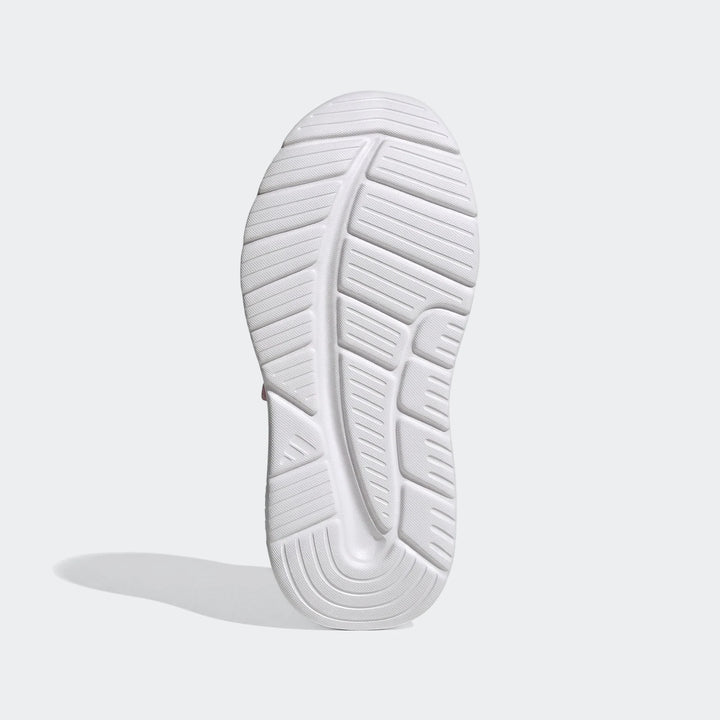 Bottom view of a white Adidas Tensaur Run 4.0 children's shoe sole, featuring a textured grip pattern.