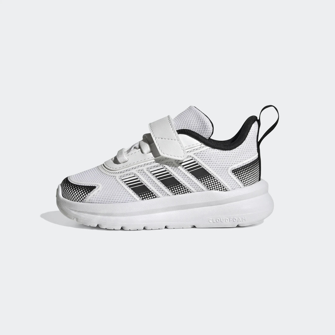 White and black Adidas Tensaur Run 4.0 Infants Shoes with velcro closure, shown from a side view.