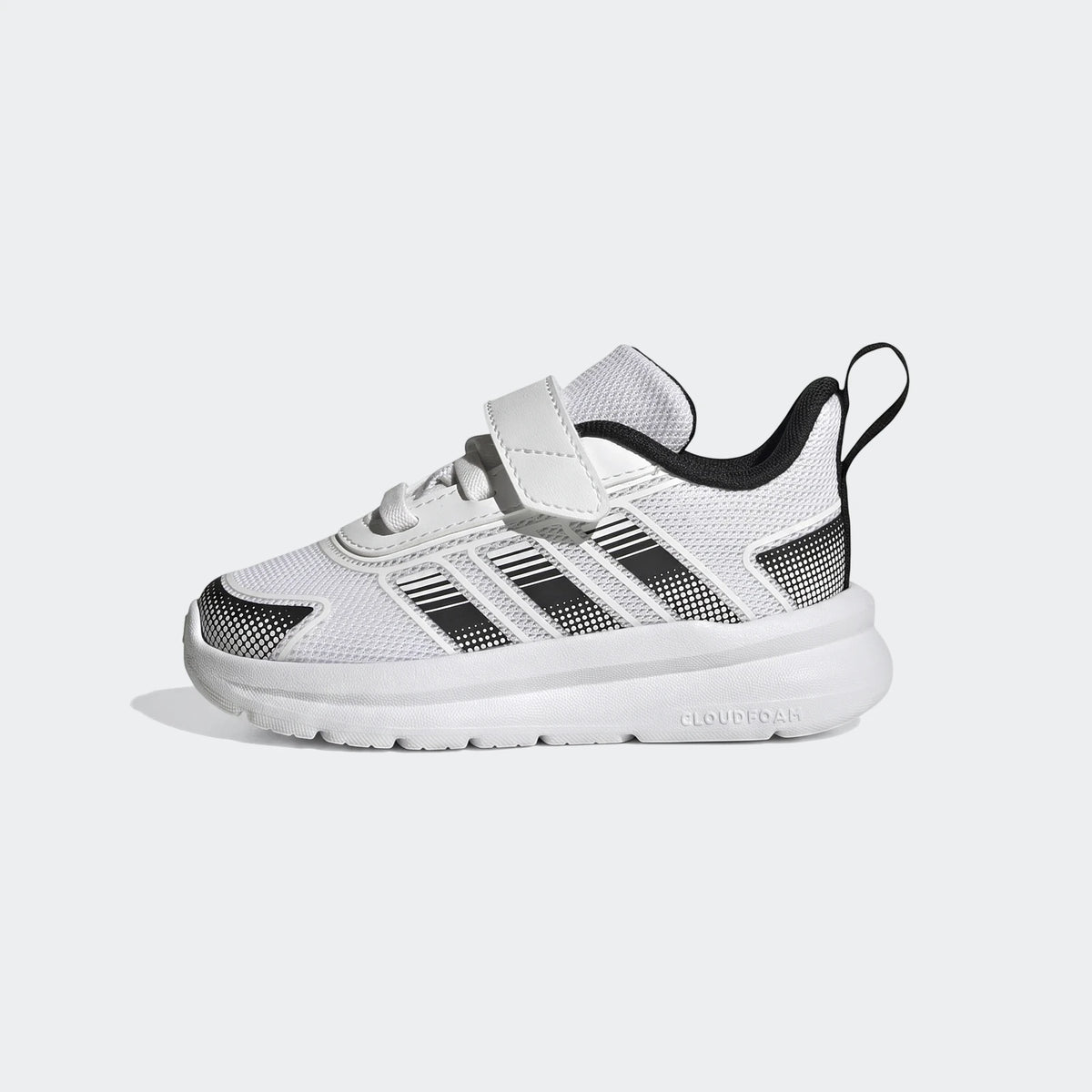 White and black Adidas Tensaur Run 4.0 Infants Shoes with velcro closure, shown from a side view.