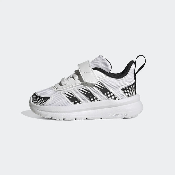 White and black Adidas Tensaur Run 4.0 Infants Shoes with velcro closure, shown from a side view.