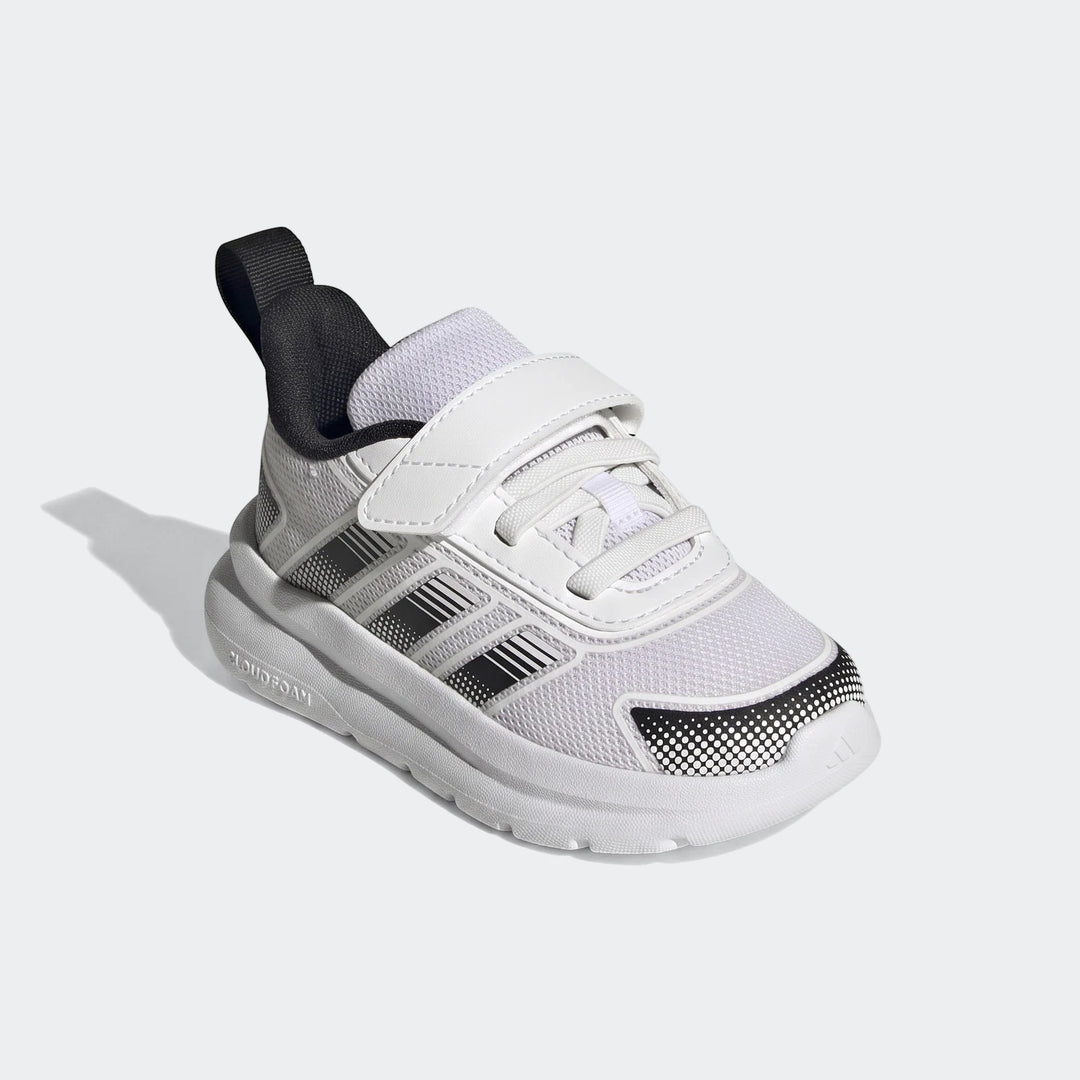 Infant's white and black Adidas Tensaur Run 4.0 shoes with hook-and-loop strap and three stripes logo on a white background.
