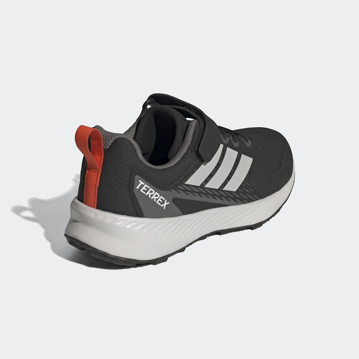 Black and grey Adidas Terrex Tracefinder Cf C kids' trainer shoe with white stripes and velcro closure, shown from a