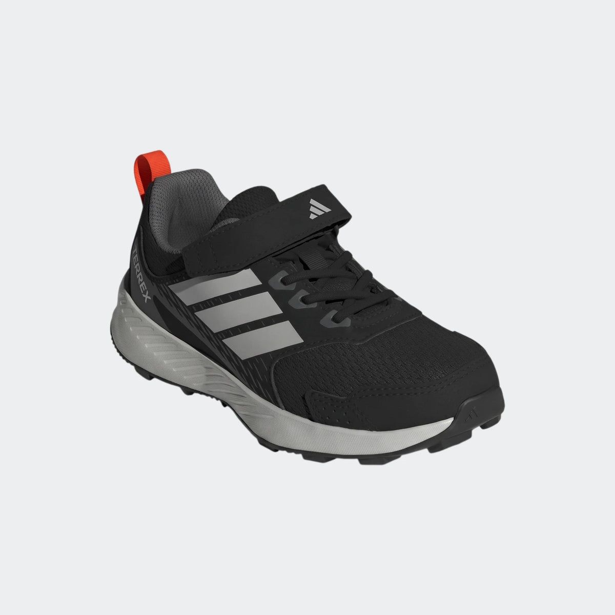 Black and grey Adidas Terrex Tracefinder Cf C kids' shoes with silver stripes and an orange pull tab, viewed from an angle.