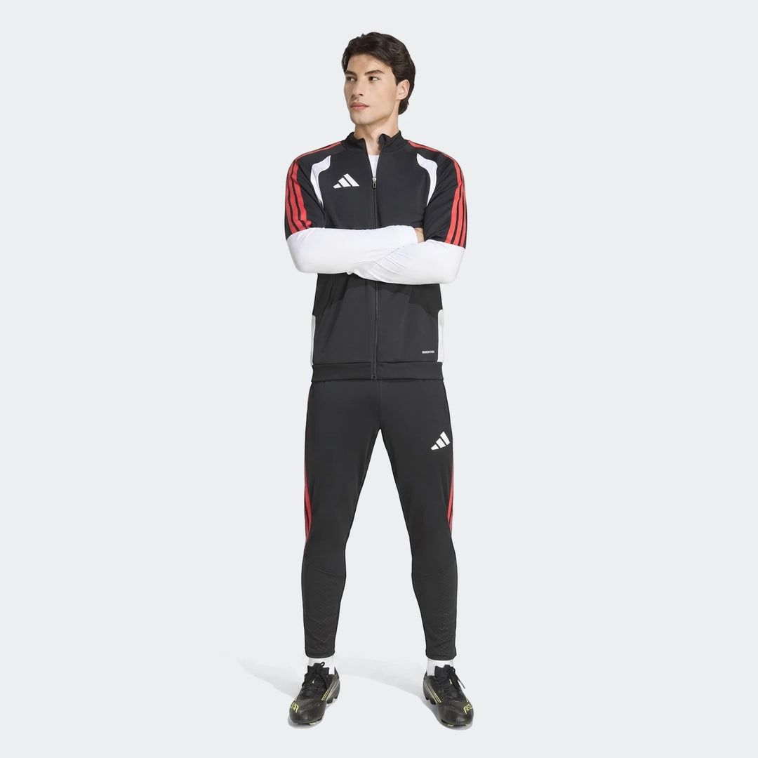 Male model wearing a black, red, and white Adidas Tiro 26 Competition Training Jacket and matching track pants.