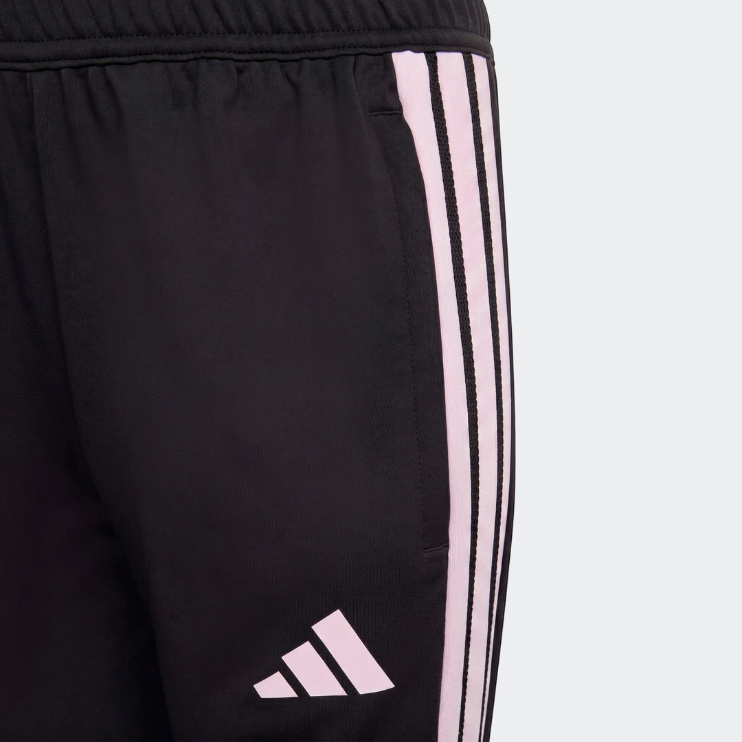 Youth black Adidas Tiro 26 Competition Training Pants with pink stripes and logo, close-up view.