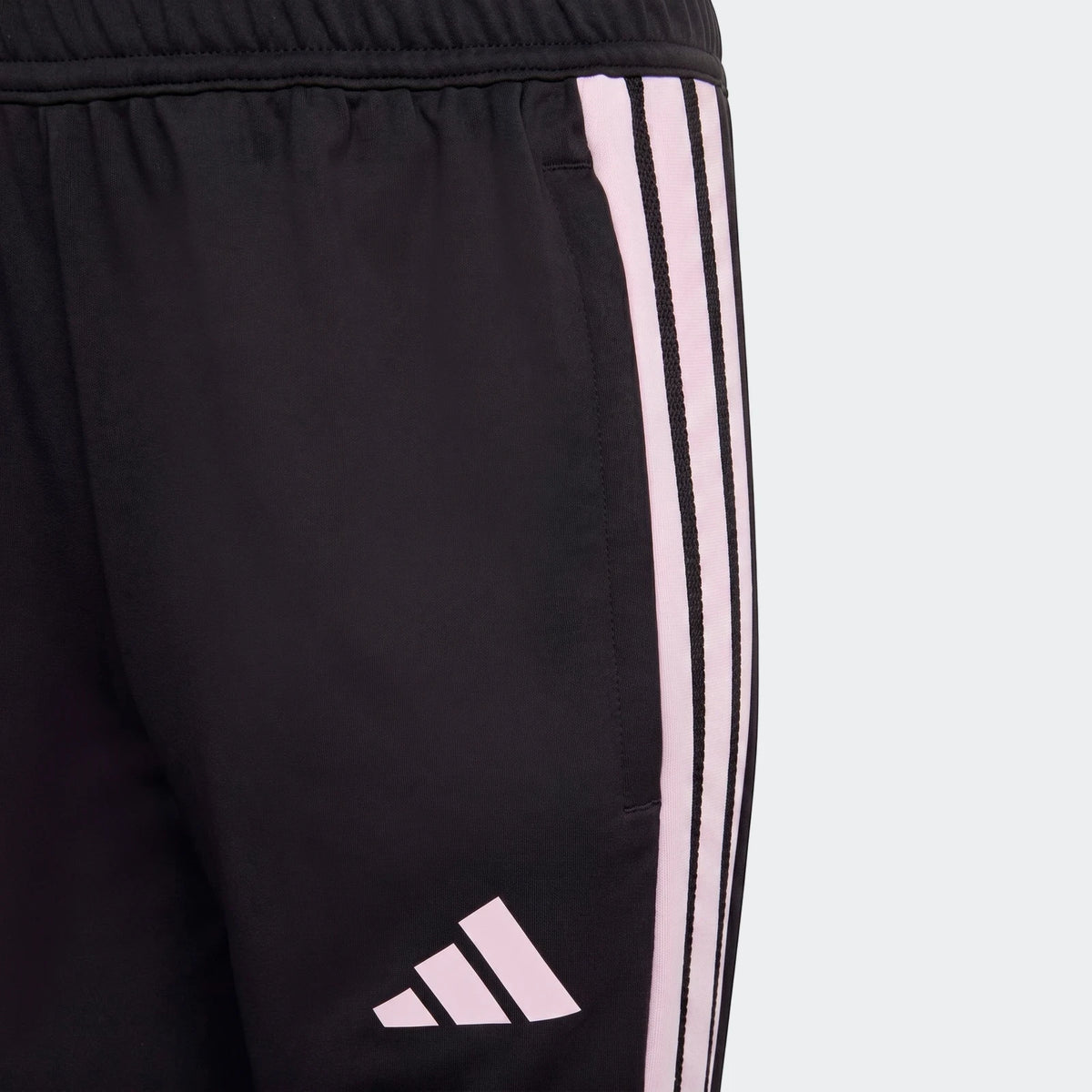 Youth black Adidas Tiro 26 Competition Training Pants with pink stripes and logo, close-up view.