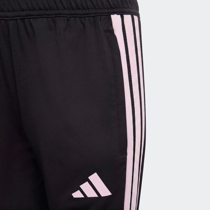 Youth black Adidas Tiro 26 Competition Training Pants with pink stripes and logo, close-up view.