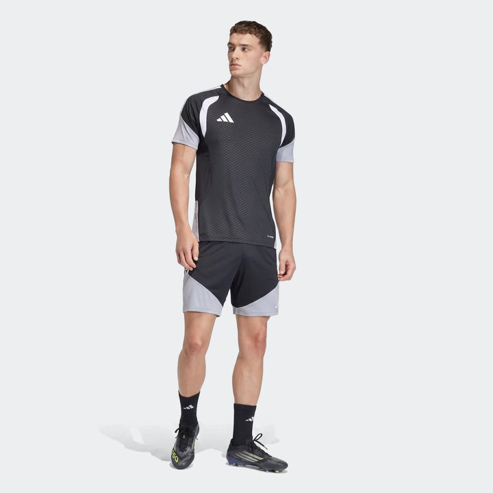 Male model wearing black and grey Adidas Tiro 26 Competition Training Shorts and matching shirt, showcasing the complete