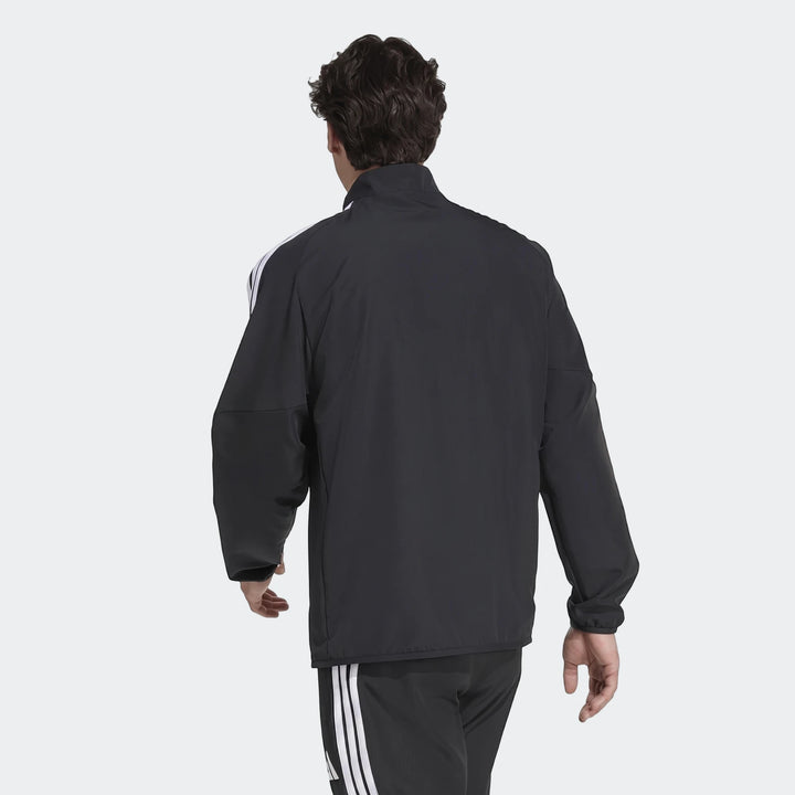 Men's black Adidas Tiro 26 League Presentation Jacket and matching track pants, rear view on model with dark hair.