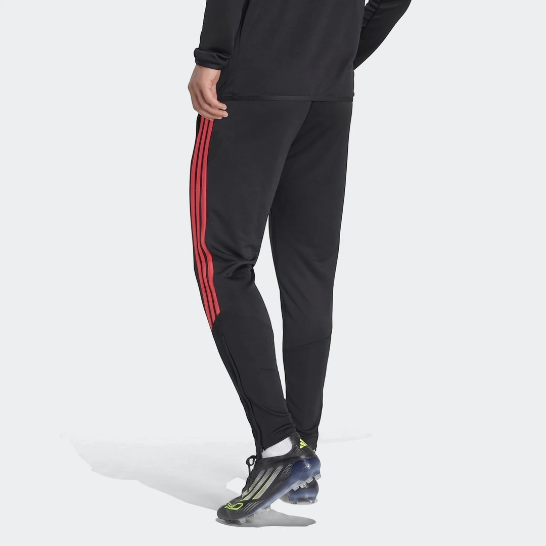 Black Adidas Tiro 26 League Training Tracksuit Bottoms with red side stripes, shown on a model from a back-left view,