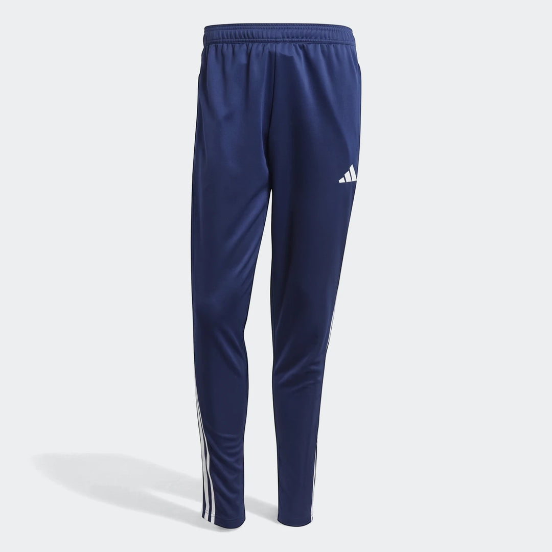 Dark blue Adidas Tiro Essentials Pants with white three stripes and logo, casual sportswear.