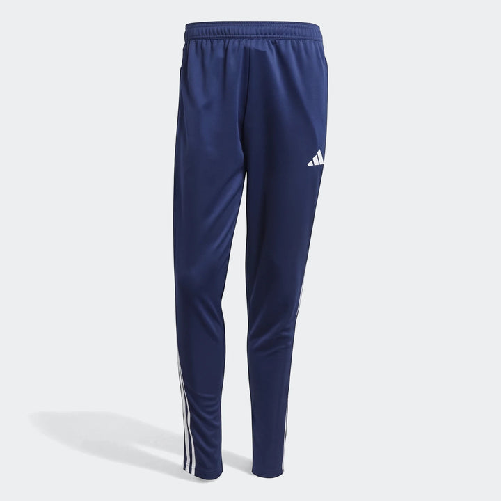 Dark blue Adidas Tiro Essentials Pants with white three stripes and logo, casual sportswear.
