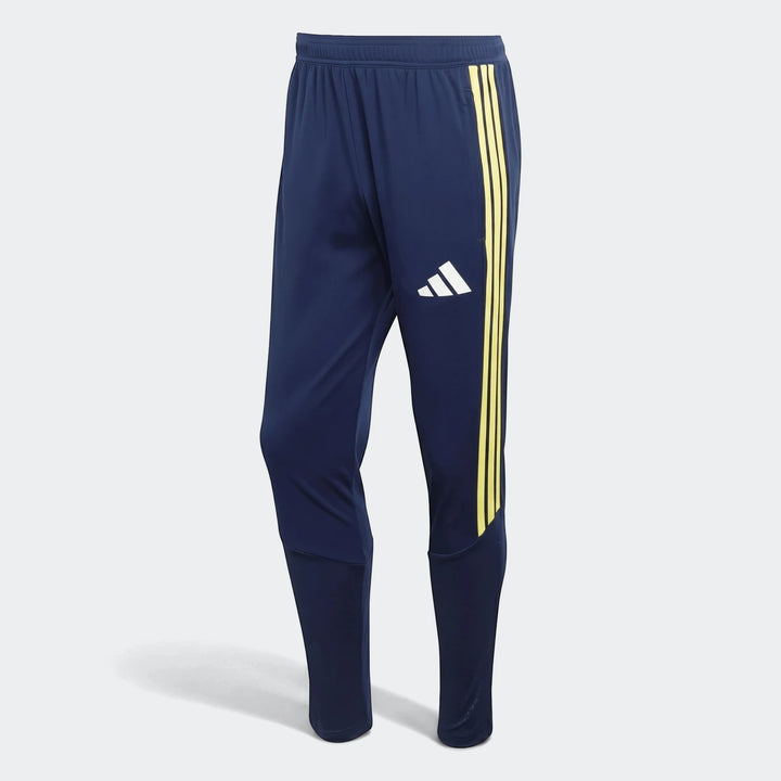 Dark blue Adidas Tiro26 C Pant athletic pants for men, featuring iconic yellow three stripes down the side and a white
