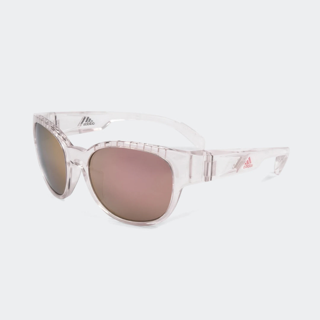 Adidas transparent frame sunglasses with reflective rose-gold mirrored lenses and ribbed detail on temples, viewed at an