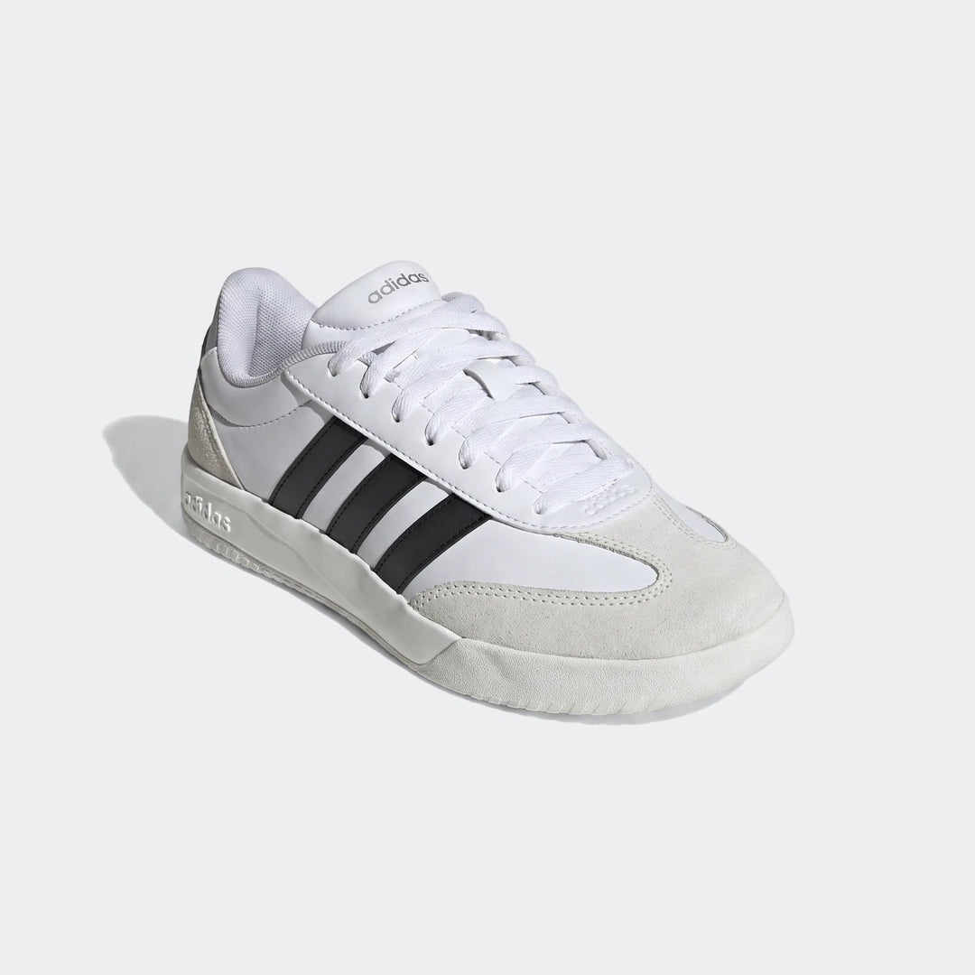 White and black Adidas Vl Court Fc Ft sneakers, featuring a low-top design with classic three stripes and suede toe detail.