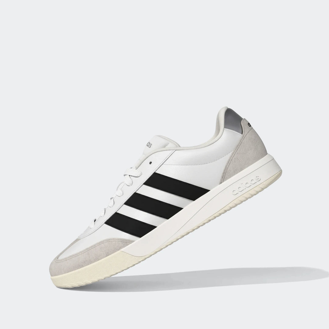 Adidas Vl Court Fc Ft White Sneakers, a low-top court style shoe with white upper, black stripes, and grey suede details.