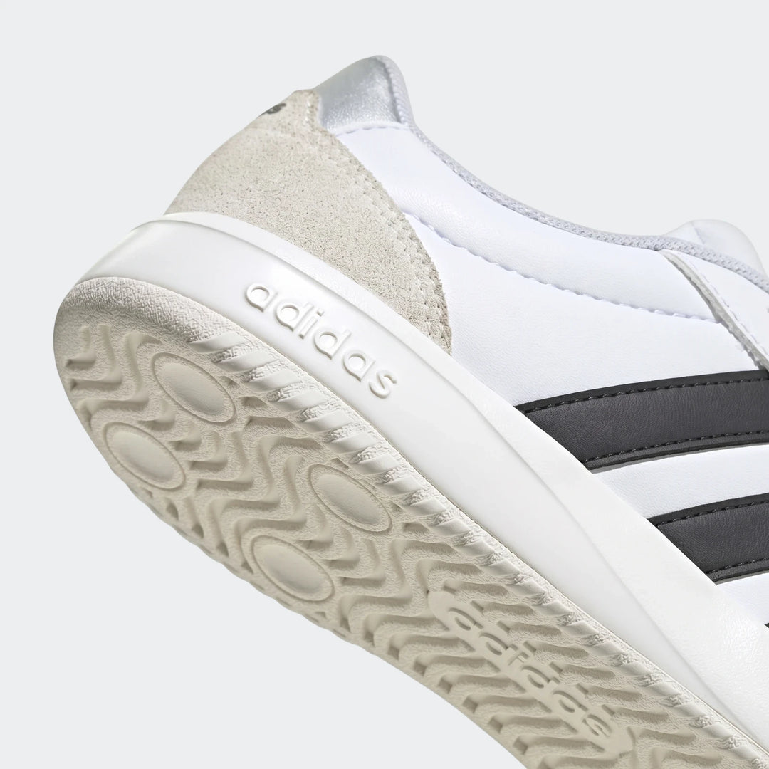 Adidas Vl Court Fc Ft White Sneakers, close-up angled view showing the white leather upper, black three stripes, and