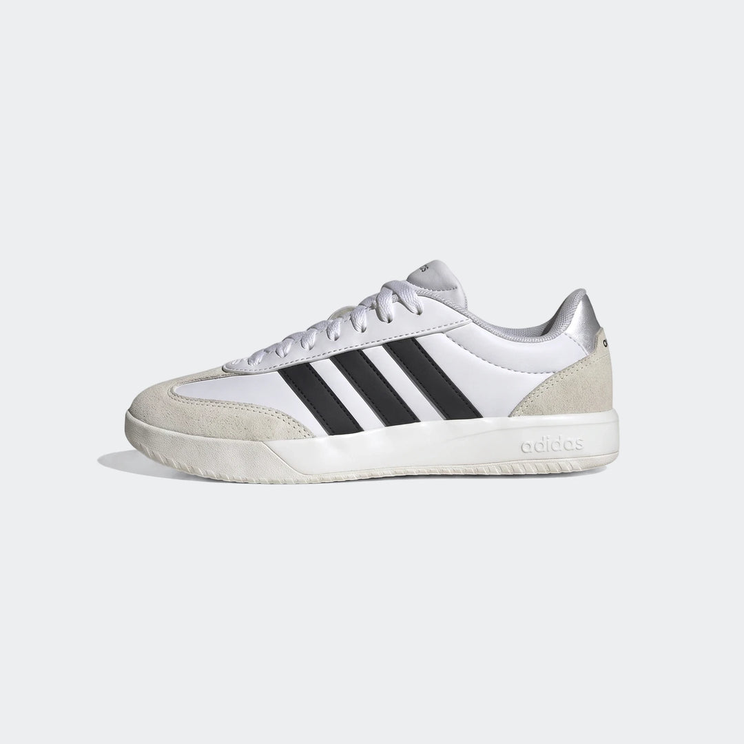 White Adidas Vl Court Fc Ft sneakers with black stripes and suede accents, shown in a side profile.