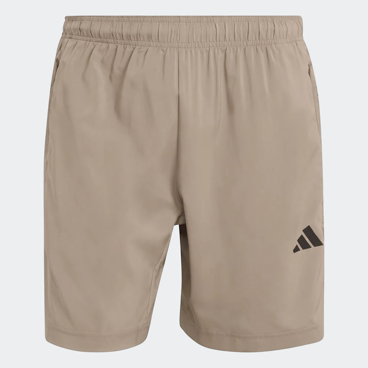 Beige Adidas Workout Essentials Base Woven Shorts for men, featuring an elastic waistband, side pockets, and black logo.