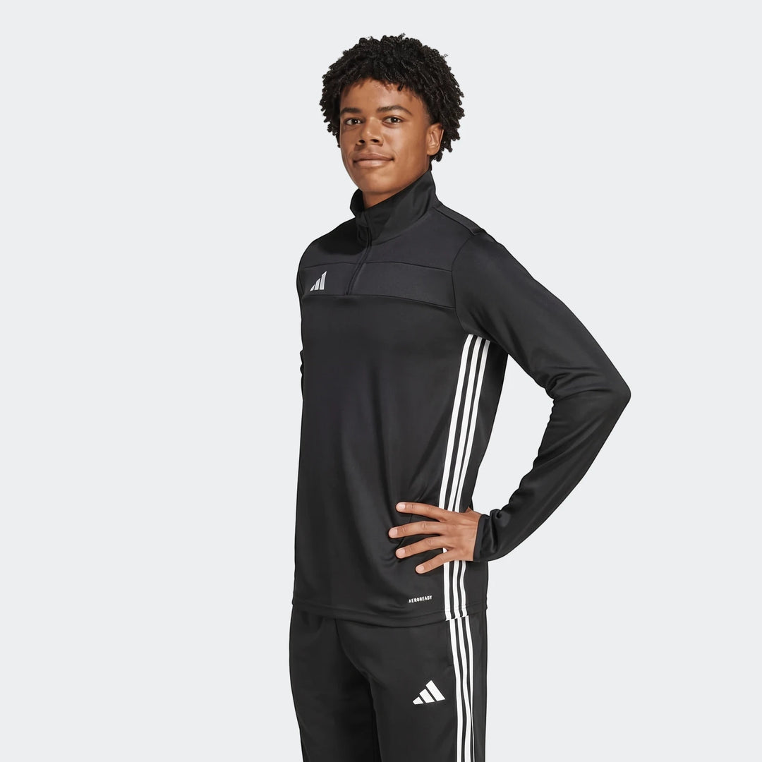 Young man wearing a black Adidas Z.N.E. Track Top with white stripes and matching pants, standing front view.