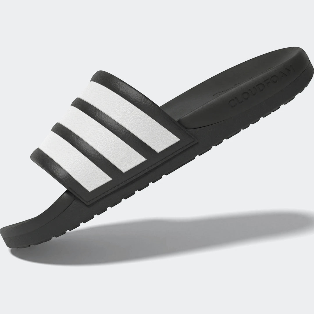 Adilette Comfort 2.0 Slides, a single black slide with white stripes, displayed from an angled view.