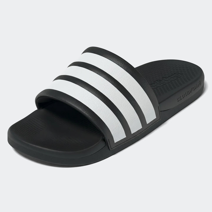 Black and white Adidas Adilette Comfort 2.0 Slides, angled view, showing textured strap with three white stripes.