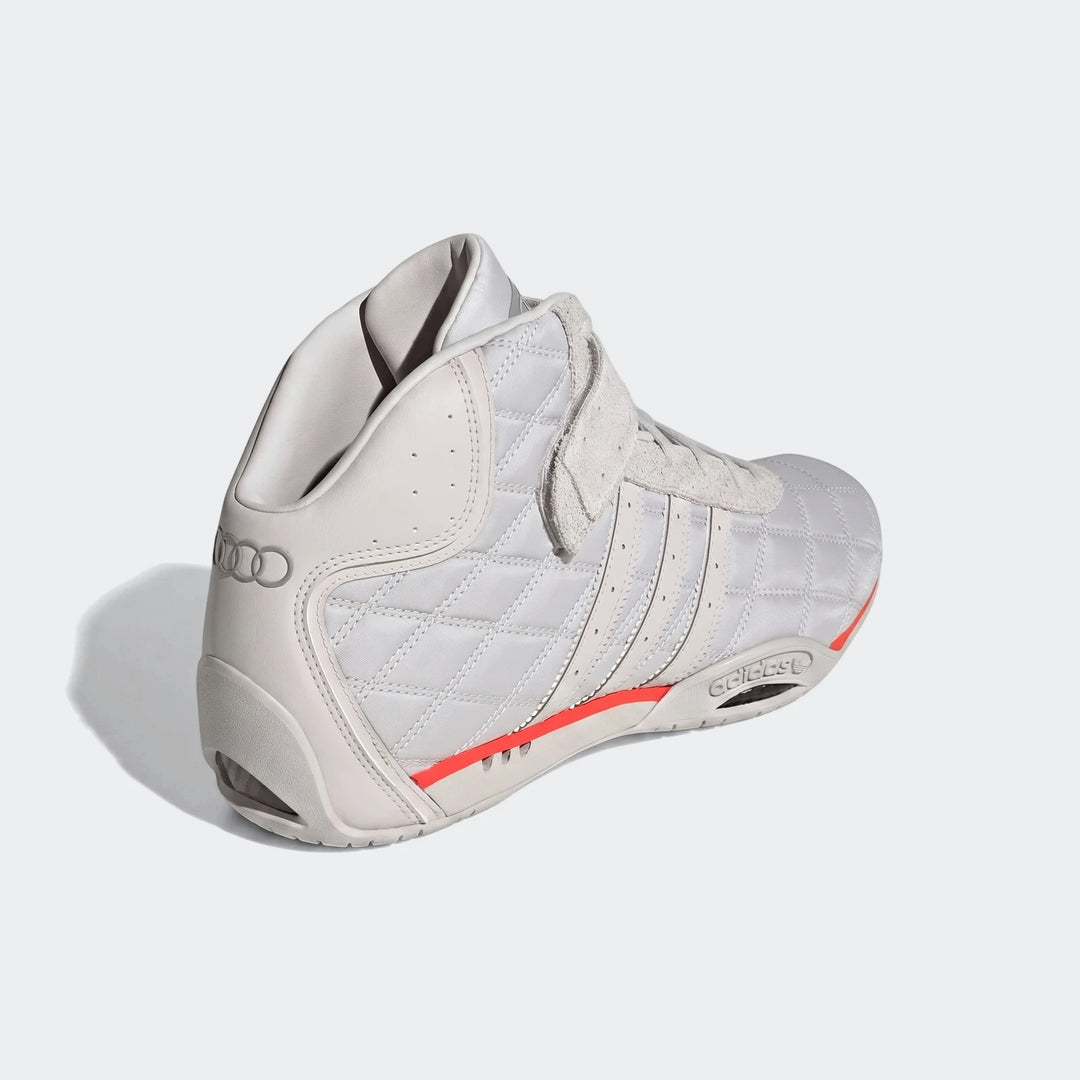 Light grey Adiracer Hi Audi Revolut F1 Team high-top racing shoes with red accents and quilted texture, angled view.