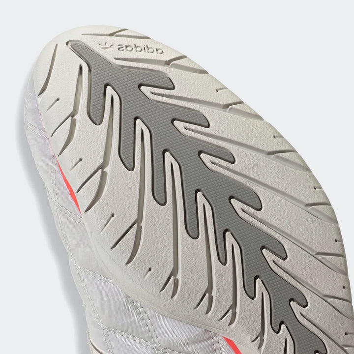Close-up view of the Adiracer Hi Audi Revolut F1 Team Shoe, showcasing its white upper and gray patterned sole.