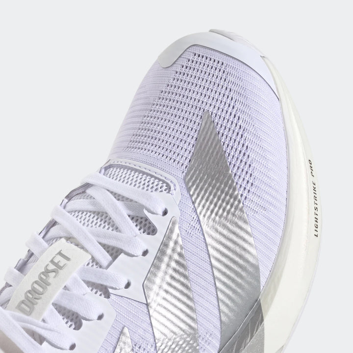 Close-up of the front top of white and silver Adizero Dropset Pro training shoes, showcasing the mesh upper and prominent