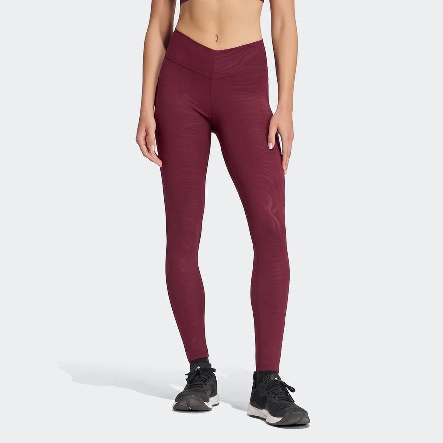 Maroon All Me Essentials Graphicleggings with a subtle pattern, shown on a model from mid-torso to feet, highlighting their