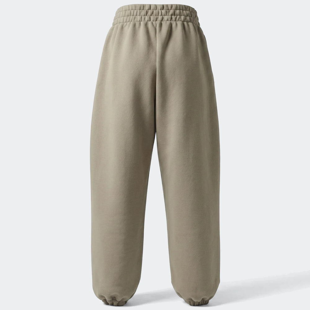 Light brown All Season Slim Pants, slim fit with elasticated cuffs, displayed from the back view for e-commerce.