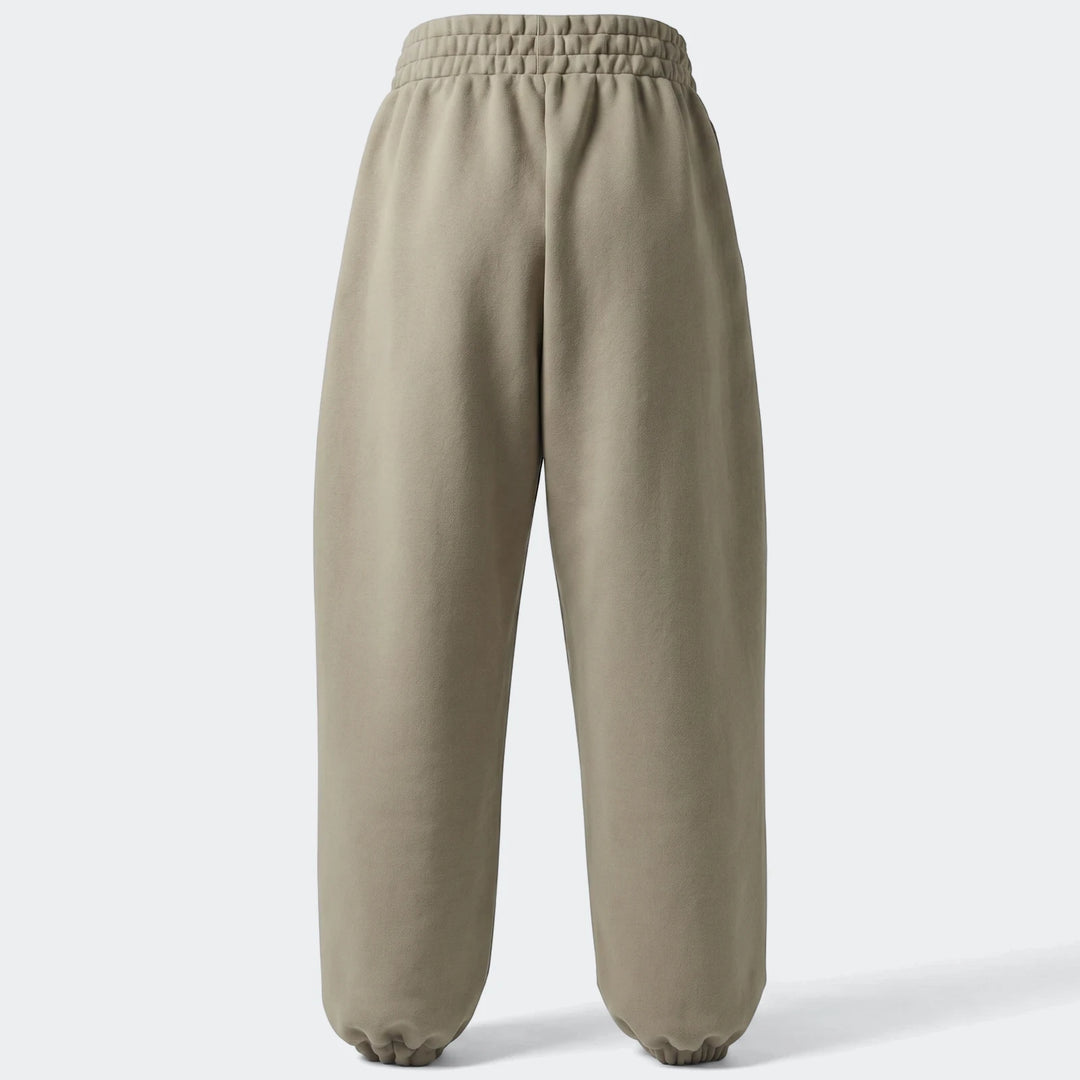 Light brown All Season Slim Pants, slim fit with elasticated cuffs, displayed from the back view for e-commerce.