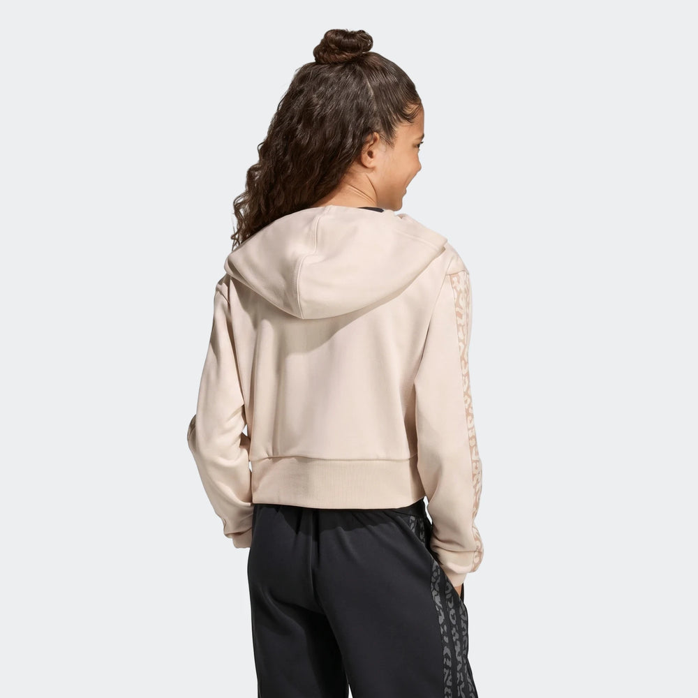 Young person in an Angled 3-Stripes French Terry Full-Zip Hoodie, light beige with patterned sleeves, seen from the back.