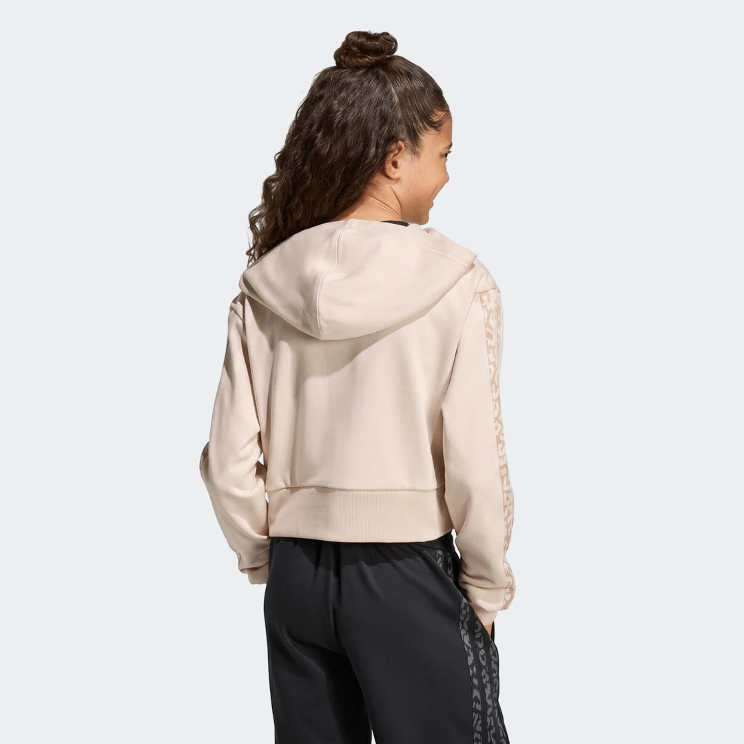 Young person in an Angled 3-Stripes French Terry Full-Zip Hoodie, light beige with patterned sleeves, seen from the back.