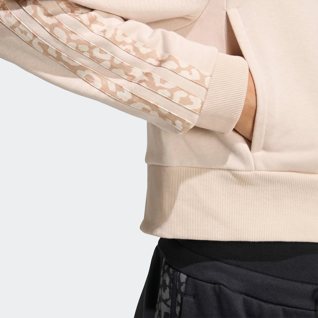 Close-up of an Angled 3-Stripes French Terry Full-Zip Hoodie in pale pink, featuring leopard-print stripes on the sleeve and