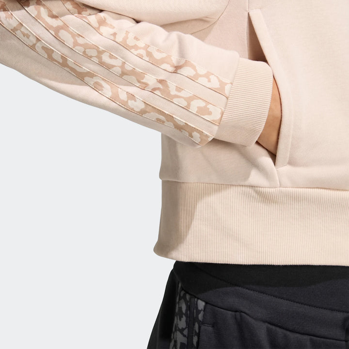 Close-up of an Angled 3-Stripes French Terry Full-Zip Hoodie in pale pink, featuring leopard-print stripes on the sleeve and