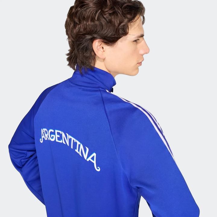 Male model showcasing a blue Argentina Originals Track Top from the back, featuring white 'Argentina' script and triple