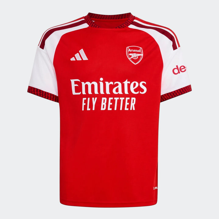 Arsenal FC 26/27 Home Kids Jersey, featuring a red body, white sleeves, and sponsor logos, displayed flat lay.