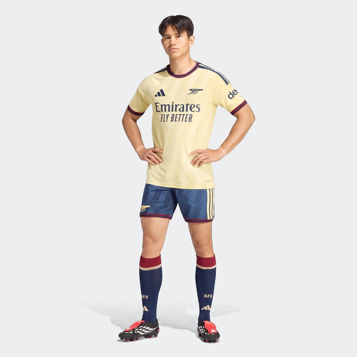 Male model wearing the Adidas Arsenal FC 26/27 Third Authentic Jersey in pale yellow with navy and maroon accents, navy