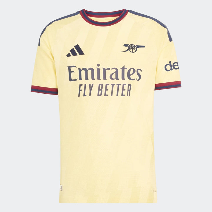 Arsenal FC 26/27 Third Authentic Jersey in yellowish cream with blue and red details, front view.