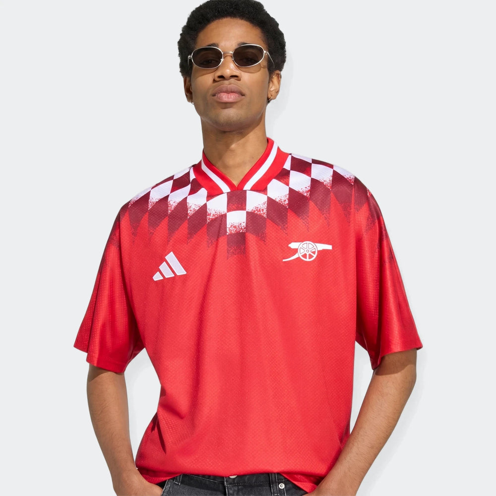 Arsenal Fc Street Jersey in red with white checkered shoulder pattern, short sleeves and V-neck, front view.