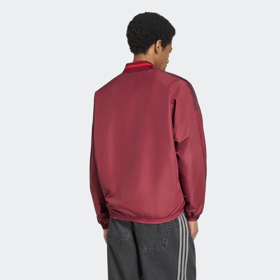 Back view of Arsenal FC Street Track Top in burgundy with high collar and long sleeves, lightweight zip jacket.