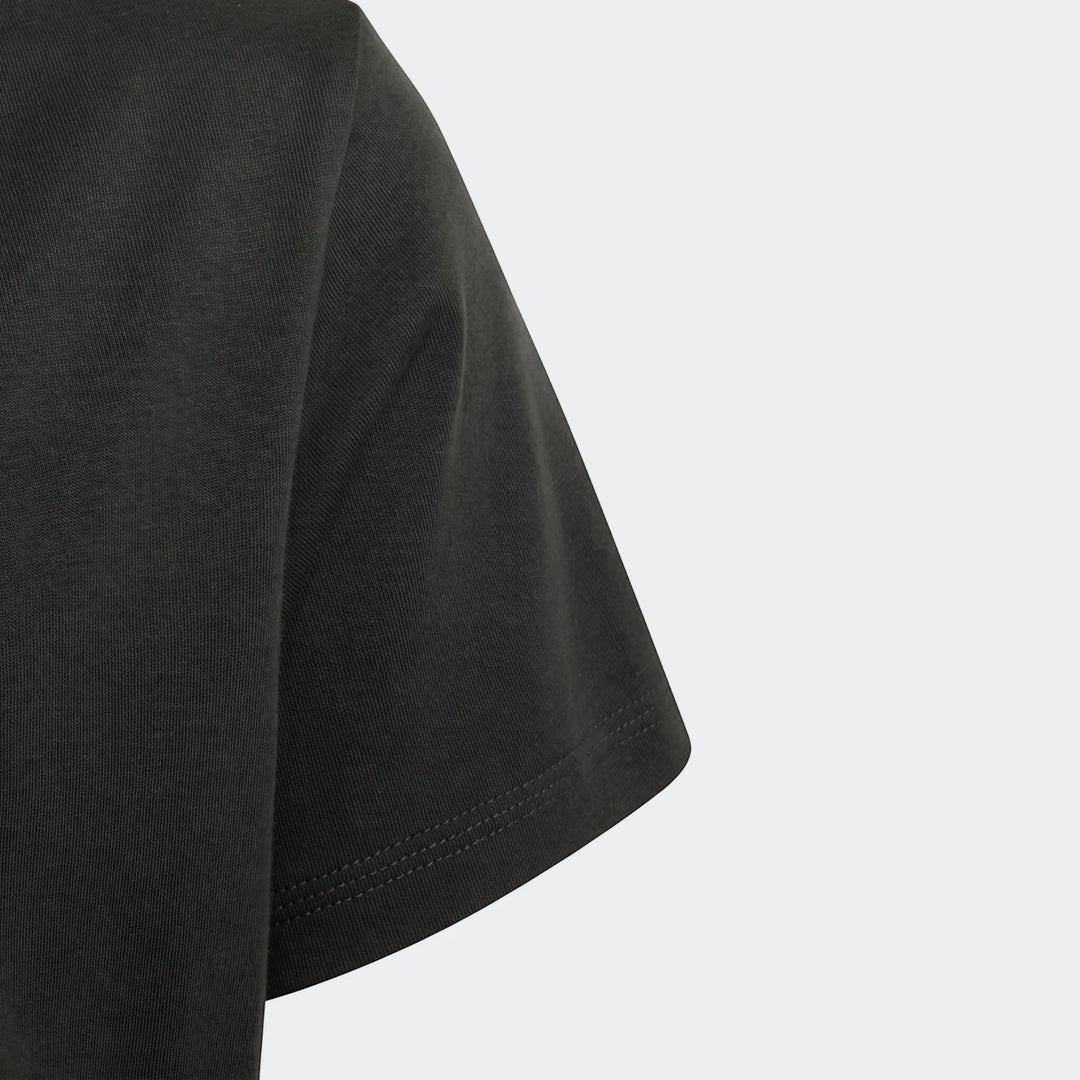 Close-up of a black Audi Revolut F1 Team Dna Graphic T-Shirt for kids, showing the sleeve and textured knit fabric.