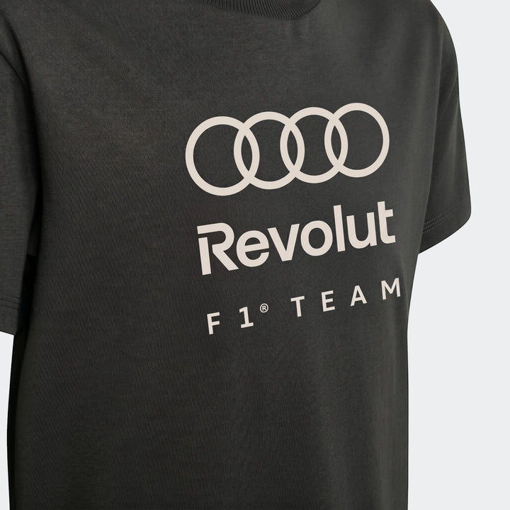 Close-up view of a dark grey kids' Audi Revolut F1 Team DNA graphic t-shirt with white logos on the chest.
