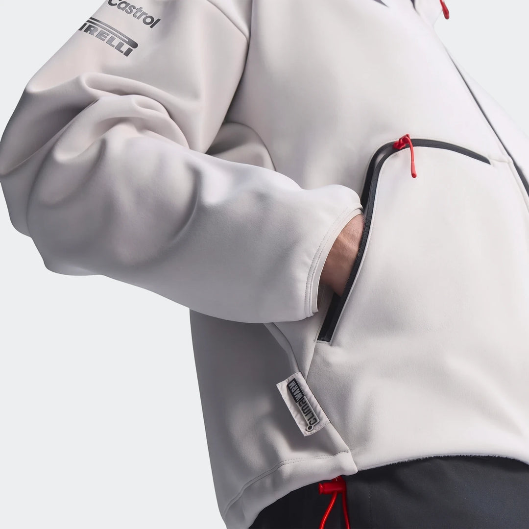 Close-up of an Audi Revolut F1 Team Engineers & Marketing Track Top in light grey, featuring Castrol and Pirelli logos on
