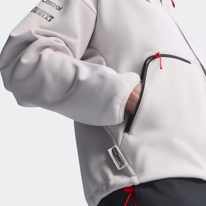 Close-up of an Audi Revolut F1 Team Engineers & Marketing Track Top in light grey, featuring Castrol and Pirelli logos on
