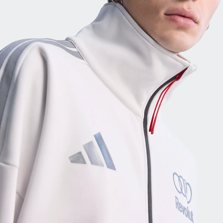 Close-up of the Audi Revolut F1 Team Engineers & Marketing Track Top, white with gray stripes, featuring Adidas, Audi, and