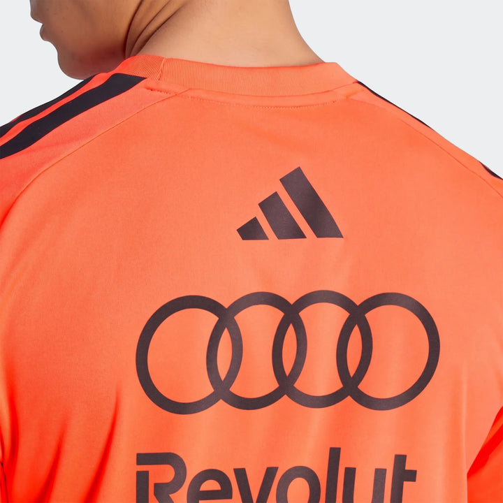 Close-up back view of an orange Audi Revolut F1 Team Setup T-Shirt, featuring Adidas stripes and logos on the back.